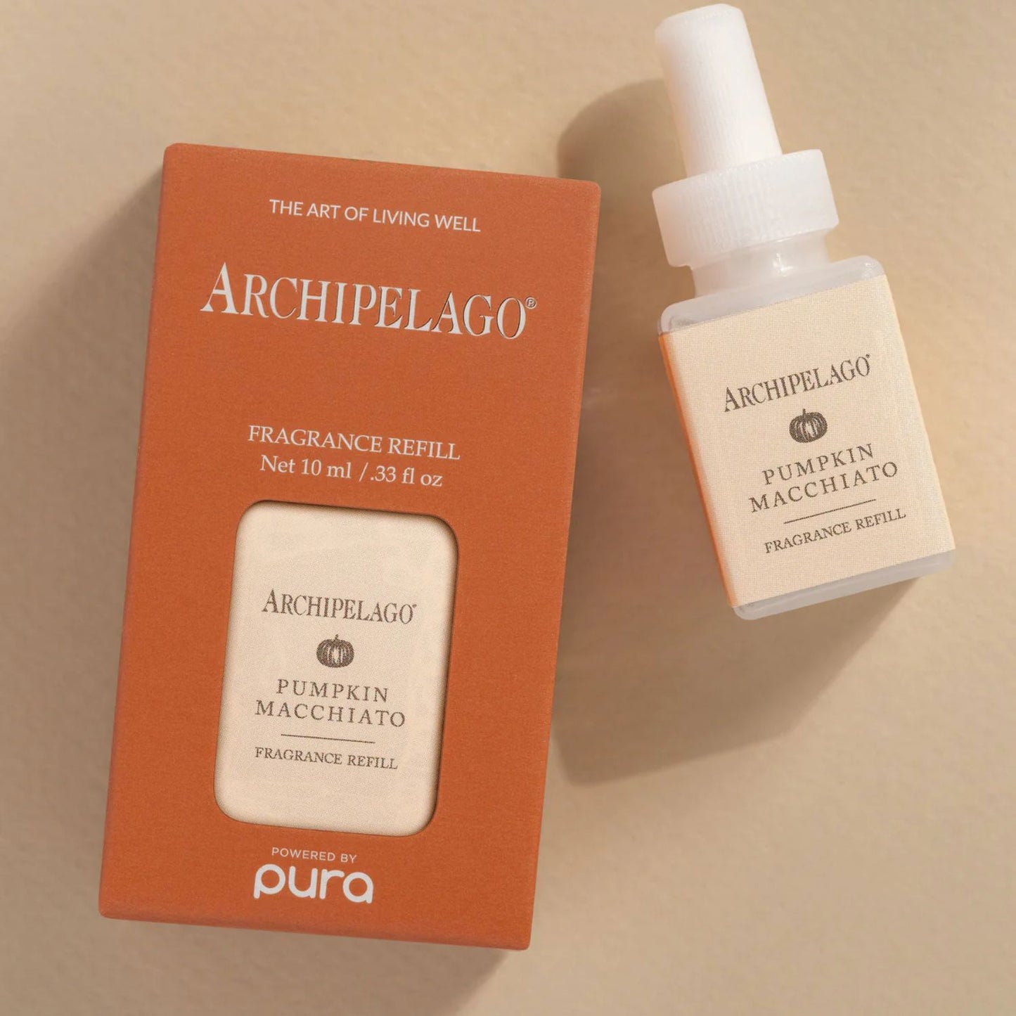 Archipelago Pumpkin Macchiato fragrance refill bottle and packaging on a beige background