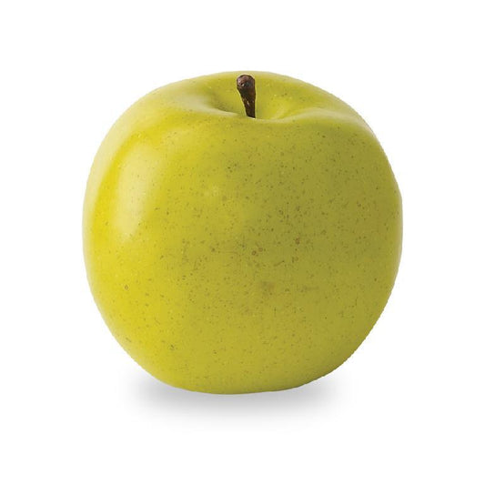 Artificial green apple as decor accent on a white background