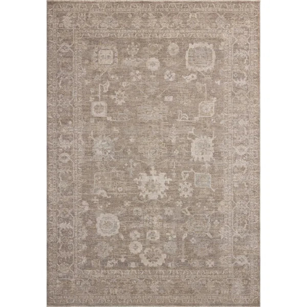 Patterned multi brown rug with intricate designs on a plain background