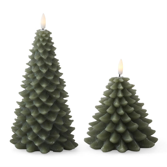 Two olive green Christmas tree-shaped candles with textured, layered scales and small glowing flame tops, shown on a plain white background.