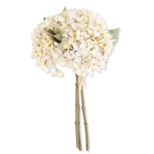 Artificial thirteen inch cream hydrangea bouquet with light green leaves and stem on a white background