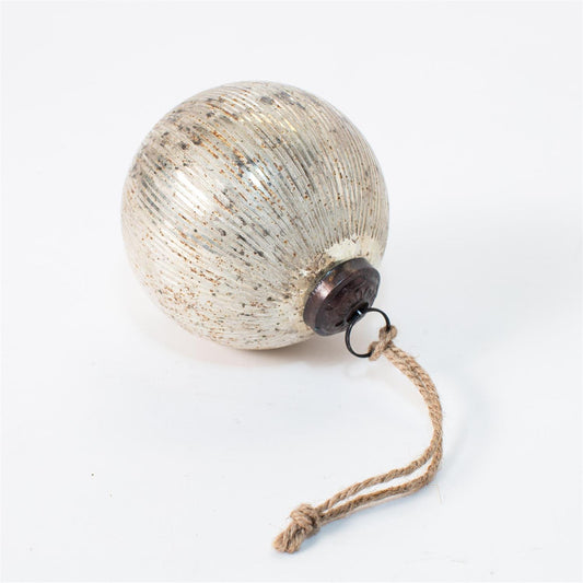 A vintage-style metallic Christmas ornament with a ribbed, textured surface in a champagne-gold and silver finish, featuring a dark metal cap and a natural jute hanging string.
